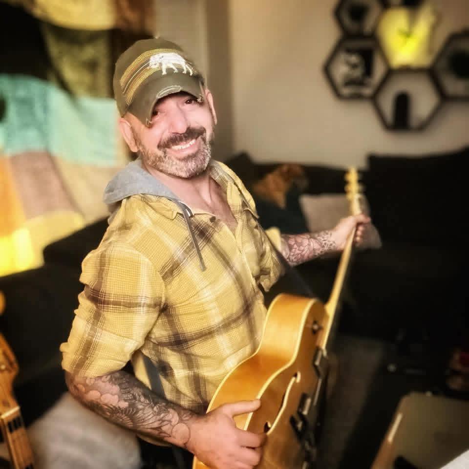 Adam Hale with guitar